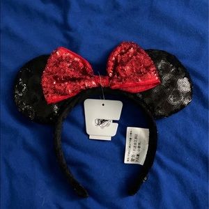 Mickey ears from Disneyland. Black and red sparkly/bling. Brand new with tags.